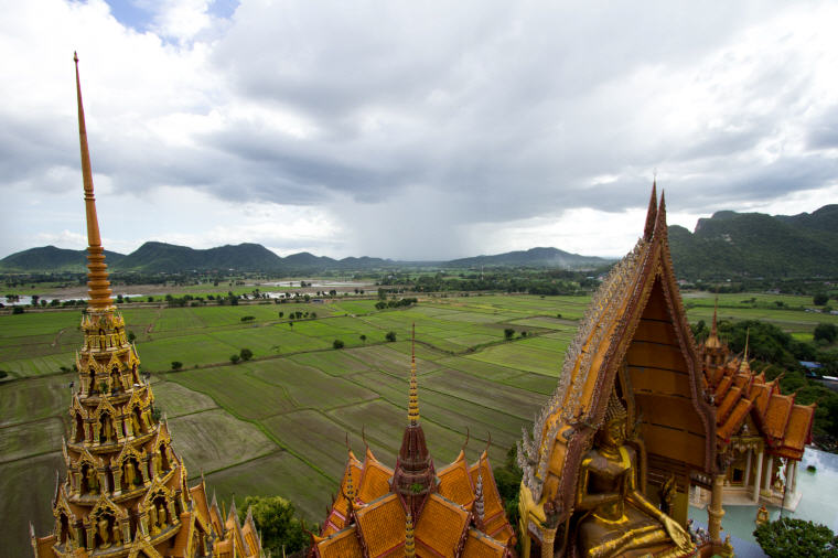 Wat Tham Sua (Tiger Cave Temple) against the green backdrop in Kanchanaburi, Best Day Trips from Bangkok: 6 Insider's Tips by Local Experts